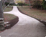 Resurfaced Driveway with 1/4 Pea Stone + Drain